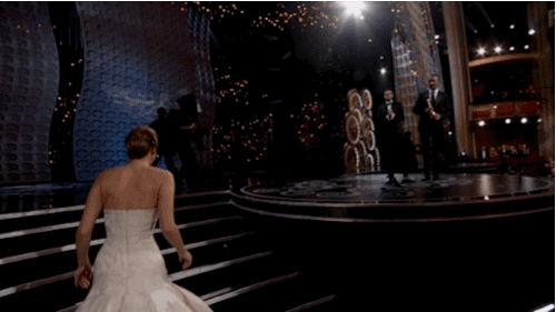 Jennifer-Lawrence-Falls-Down-While-Receiving-Her-Award-For-Silver-Linings-Playbook.gif